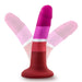 The Lesbian Pride Small 5.5 Inch Silicone Suction Cup Dildo stands upright, showcasing lesbian flag colors in silky silicone. Transparent overlays highlight its flexibility and vibrant shades of red, pink, and purple.