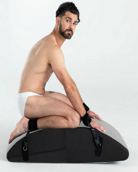 Dark haired caucasian male model  on Liberator Scoop Rocker Wedge with Cuffs - Grey