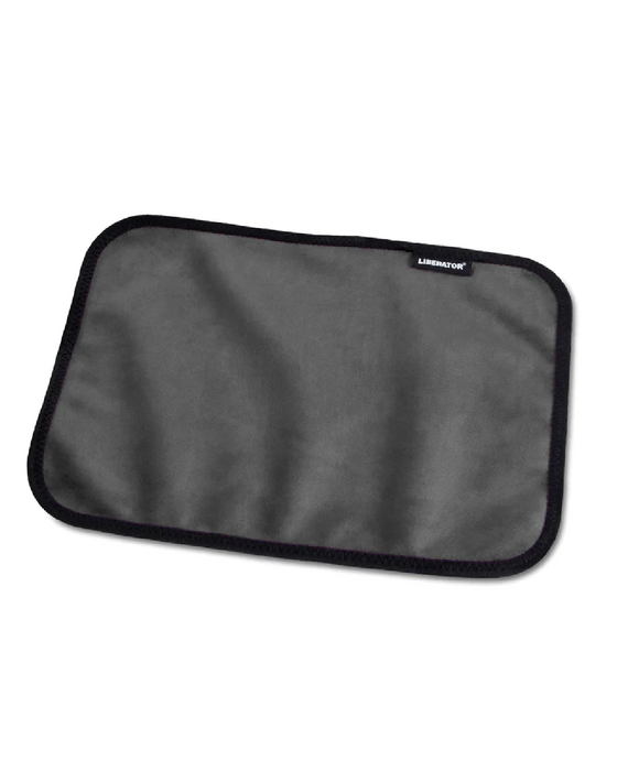 A rectangular, black Liberator laptop sleeve with rounded corners, displaying a minimalistic design and featuring a subtle logo in the top right corner, is made from stain-resistant fabric. The item is placed on a white.