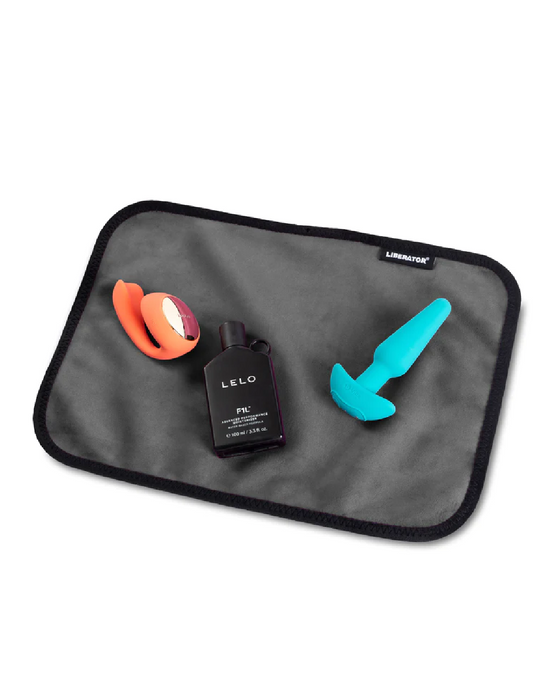 Liberator Fascinator Toy Pad Mini Waterproof Sex Blanket - Black with toys on it 