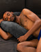 Black male model laying against Liberator Lune Toy Mount Sex  Pillow - Black