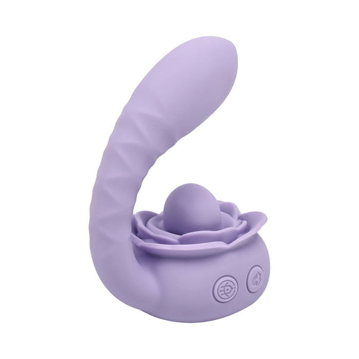 The Lilac Licks Clitoral & G-Spot Vibrator with Tongue Tease is a purple silicone toy with a curved, textured shaft, a rose-shaped base, and dual control buttons for targeted stimulation.