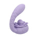 The Lilac Licks Clitoral & G-Spot Vibrator with Tongue Tease is a purple silicone toy with a curved, textured shaft, a rose-shaped base, and dual control buttons for targeted stimulation.
