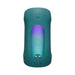 A teal, cylindrical electronic device operates hands-free with a power button on top and a display of purple-to-blue lights. It features symbols and "Lovense" on the front, compatible with the Lovense app for easy control. Product: Lovense Gush 2 Hands-Free Oscillating Masturbator with App.