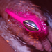 A close-up of the Lovense Lush 4 Sound Activated Bluetooth Wearable Vibrator, pink and silver, is held under running water, creating ripples and reflections against a softly lit pink background.
