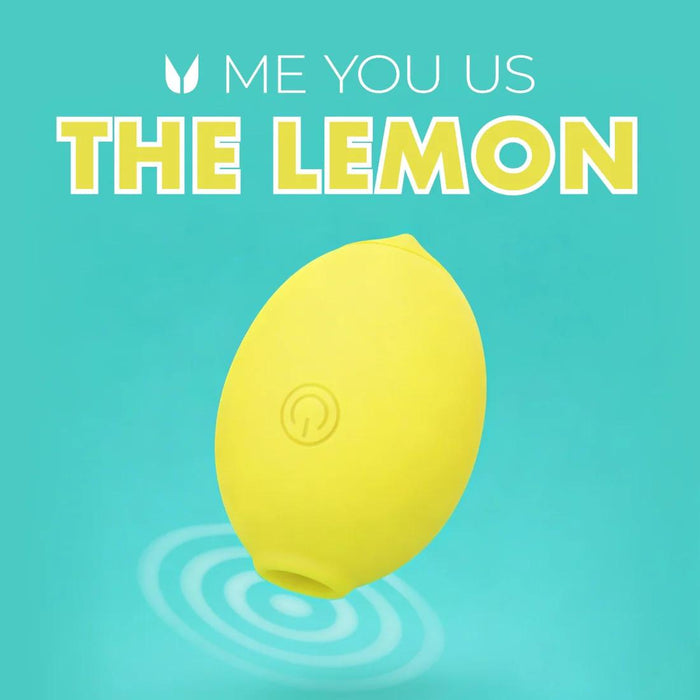 A yellow, lemon-shaped object with a power button symbol floats above blue ripples on turquoise, suggesting clitoral pleasure. Bold text above reads "ME YOU US THE LEMON Powerful Clitoral Air Pulsation Suction Vibrator.