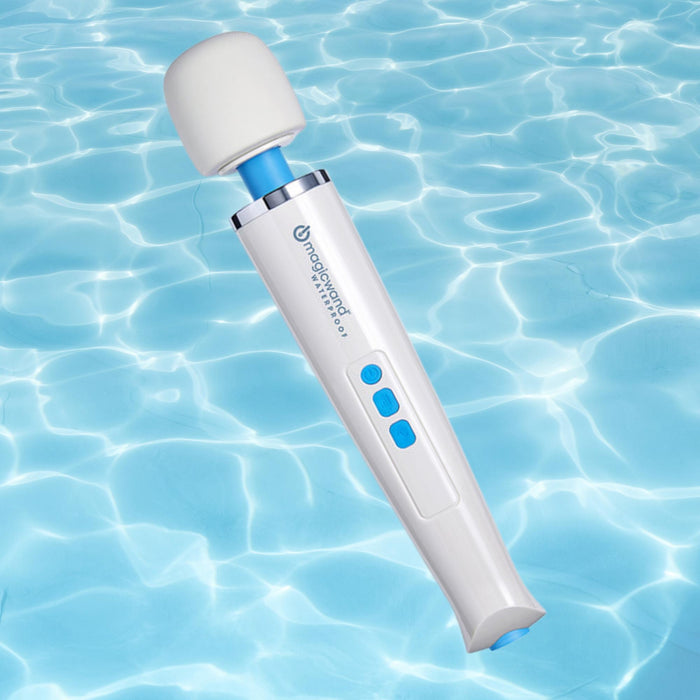 A Magic Wand Waterproof Rechargeable Cordless Vibrator in white and blue with buttons floats above rippling water.