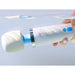 A hand holds a Magic Wand Waterproof Rechargeable Cordless Vibrator, partially submerged in water, with its blue buttons and name visible—a powerful vibrator made for wet environments.