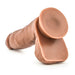 Manny the Fireman Realistic 6.75 Inch Medium Tone Dildo is made from silicone, with an exaggerated flat circular suction cup base for hands-free use, displayed against a white background.