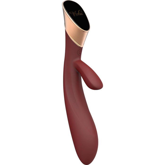 The Metis Touch Panel Rabbit Vibrator is maroon and gold with a sleek, ergonomic design, featuring a curved shape, smooth handle, and a smaller external arm for dual stimulation.