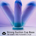 The Midnight Rendezvous Textured 7.5 Inch Girthy Blue Silicone Dildo stands upright with a strong suction cup base for hands-free pleasure & play, crafted from body-safe silicone in striking blue and purple.