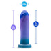 The Midnight Rendezvous Textured 7.5 Inch Girthy Dildo is a blue and purple, medium-sized silicone toy with a flared base, harness compatibility, 7.5" height, 1.75" width, and 7" insertable length.