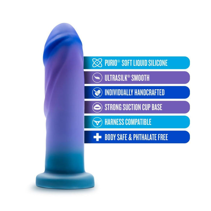 The Midnight Rendezvous Textured 7.5 Inch Girthy Blue Silicone Dildo is shown with features: Purio® soft liquid silicone, Ultrasilk™ smooth, strong suction cup base, strap-on harness compatible, and phthalate free.