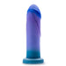 The Midnight Rendezvous Textured 7.5 Inch Girthy Blue Silicone Dildo features gradient blue and purple tones, a realistic texture, a flared base, is strap-on harness compatible, and crafted from body-safe silicone; shown upright on a white background.