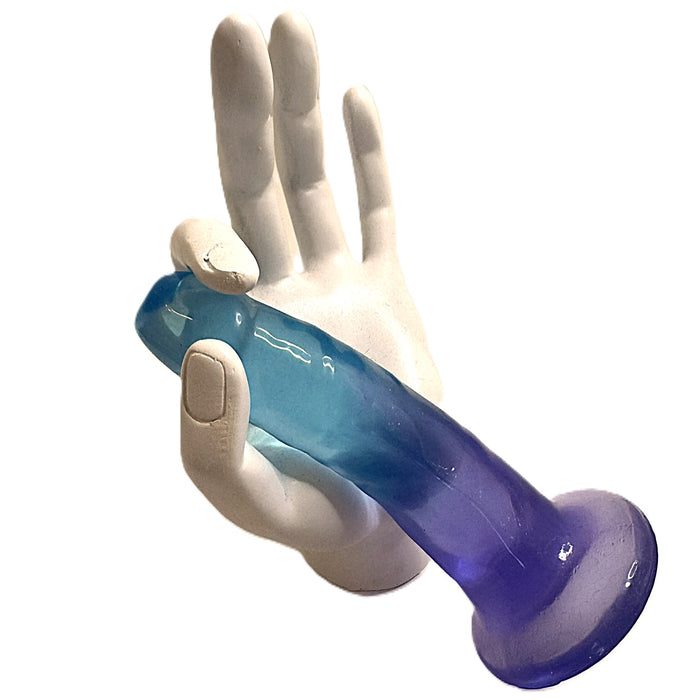 A white mannequin hand holds the Morning Dew Slim Small 5 Inch Blue Dildo with Suction Cup, featuring a blue and purple gradient, against a white background.