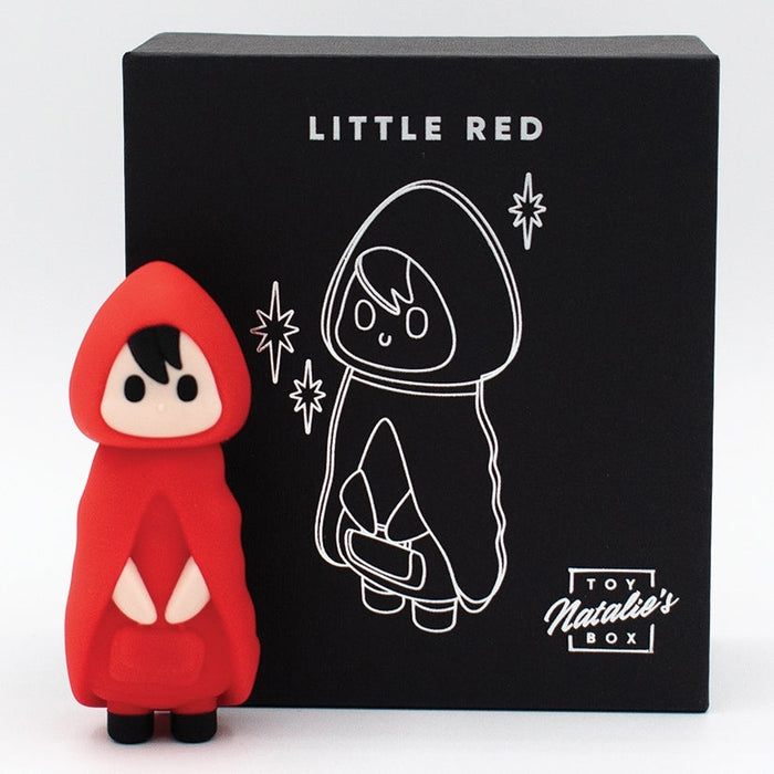 A cute toy figure in a red hooded cloak stands before a black box labeled "Little Red Discreet Powerful Bullet Vibrator," featuring a white outline of the character and promising discreet yet powerful vibrations inside.