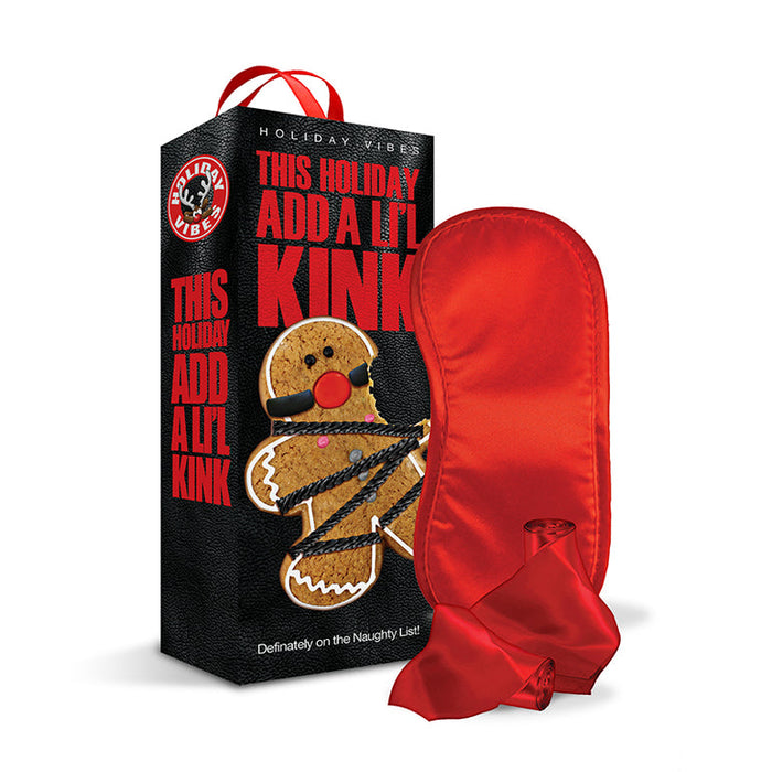 The Naughty List Holiday Vibes Kink Gift Set includes a playful gingerbread cookie with a ball gag and rope, plus a red satin blindfold—perfect for couples who want to add some cheeky fun to the holidays.