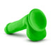 The Neo Elite Beginner 6 Inch Dual Density Dildo is a bright green silicone dildo with balls and a flat, circular base, displayed on a white surface.