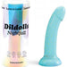 The Nightfall Smooth 7 Inch Teal Glitter Silicone Dildo with Suction Cup stands upright beside its packaging, featuring icons for body-safe silicone and suction base—ideal for pegging or g-spot play.