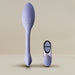 The Niya Rechargeable Kegel Exerciser and Vibrator with Remote, featuring a purple silicone textured oval head and long handle, is shown alongside its matching two-button wireless remote on a neutral background for pelvic floor strengthening.