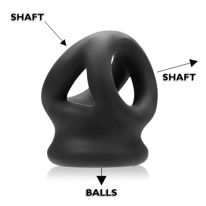 The Oxballs Tri Squeeze Cocksling Ball Stretcher in blue is a silicone sex toy with three holes, designed as a cock ring and ball stretcher. It features arrows and labels for "SHAFT" and "BALLS," shown against a white background.