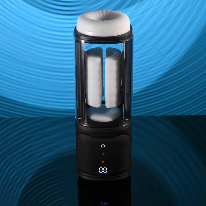 The Playboy Side Piece Heated Sliding Stroker, a black and transparent cylindrical masturbator with a soft white interior and digital display, sits on a reflective surface against a blue wavy background.