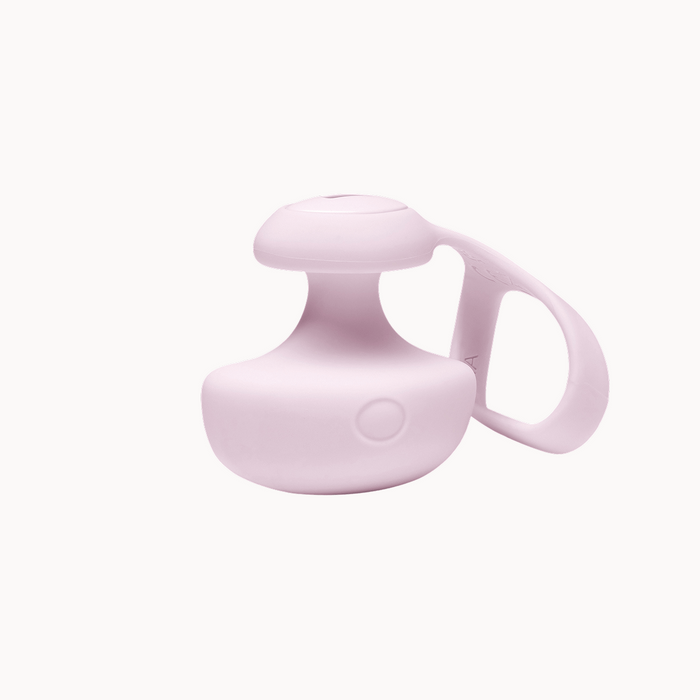 Light pink, compact silicone finger vibrator with a removable tether and intuitive control button.