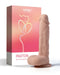 A Paxton Powerful Vibrating Rotating 8.5" Realistic App Controlled Dildo next to its packaging box labeled "Honey Play Box Paxton March into Orgasm Land" with a peach and pink design featuring a stylized heart.