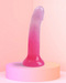 Sunrise Pink Ombre Glitter 7 inch Silicone Dildo on pink background 