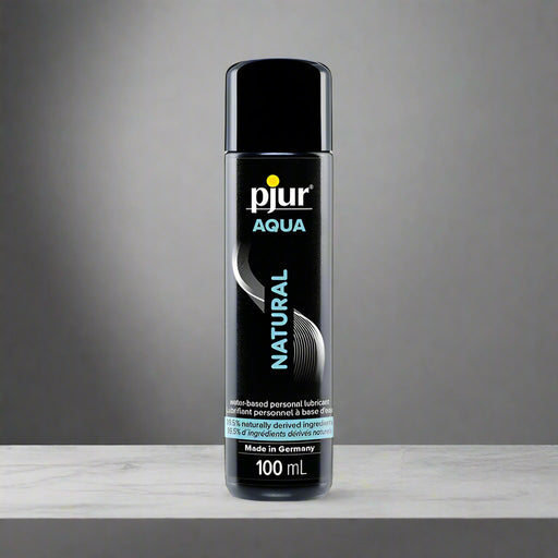 The 3.4 oz Pjur Aqua Natural Water-Based Personal Lubricant comes in a black bottle with a white and teal label, highlighting its moisturizing, biocompatible formula. This lubricant is water-based and made in Germany.