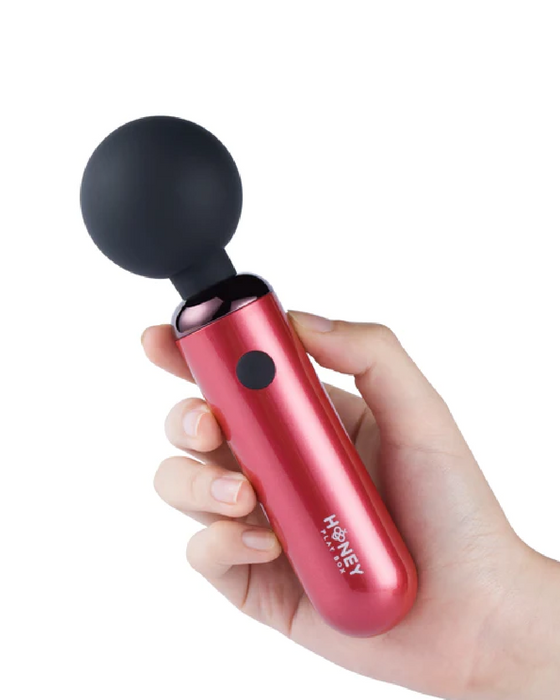 Pomi Petite Clitoral Wand Vibrator - Red in hand 