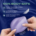 Hands squeeze the Pulse Pad Squishy Silicone External Vibrator with Remote, violet-hued on a silky blue background. Features: 100% body-safe platinum-cured liquid silicone, satin smooth finish, easy to clean with soap & water.