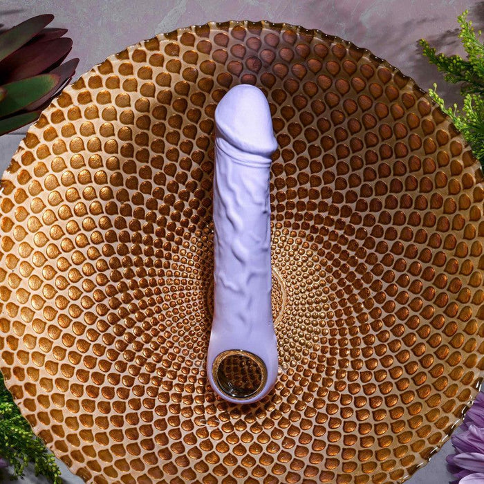 Lavender silicone vibrating dildo with realistic veins, a defined head, and a metallic finger loop base.