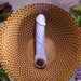 Lavender silicone vibrating dildo with realistic veins, a defined head, and a metallic finger loop base.