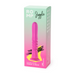 The ROMP Jiggle Thrusting Vibrator with Suction Base is displayed on its packaging, featuring a pink design, a gradient green-to-pink background, and highlights such as hands-free use listed on the side.