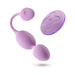 The Raine Vibrating Kegel Ball with Remote Control is a lavender personal massager featuring kegel balls at each end of a flexible shaft, and includes a matching oval remote for wireless control to enhance pelvic floor wellness.