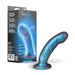 The Rebellion Small 5.75 Inch Blue Silicone Beginner & Pegging Dildo, shown upright with its detailed packaging, features a shimmery blue platinum-cured silicone design and a flared base perfect for strap-on and pegging play.