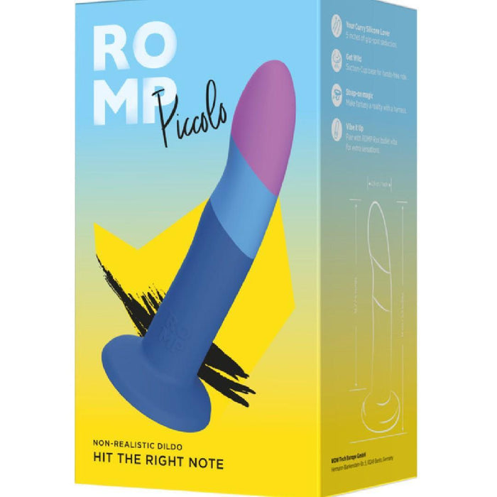 The Romp Piccolo Sleek First Time 5 Inch Silicone Dildo with Suction Cup comes in a blue and yellow box featuring the toy’s blue body and pink tip, with the tagline “Hit the Right Note.” Ideal for g-spot or anal play exploration.