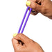 Two hands with yellow-painted nails stretch a purple Romp Remix Easy to Use Cock Ring Trio ring against a white background.