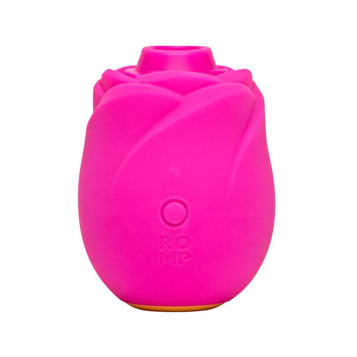 The Romp Rose 2 Pleasure Air Clitoris Stimulator is a bright pink, rose-shaped silicone vibrator with "ROMP" embossed on the front and a circular button, designed for clitoral stimulation using Pleasure Air Technology, shown on a white background.