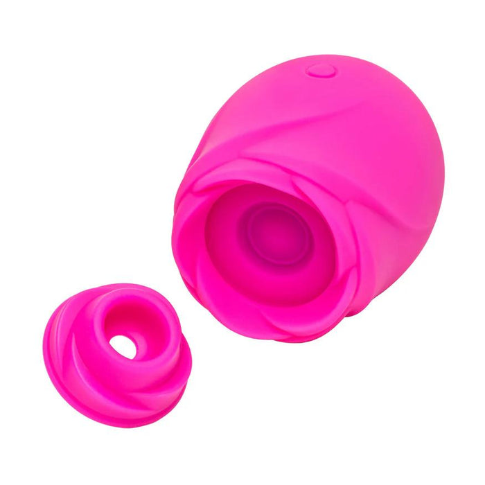 The Romp Rose 2 Pleasure Air Clitoris Stimulator, a bright pink, rose-shaped silicone vibrator with a removable cap for clitoral stimulation, is displayed on a plain white background.