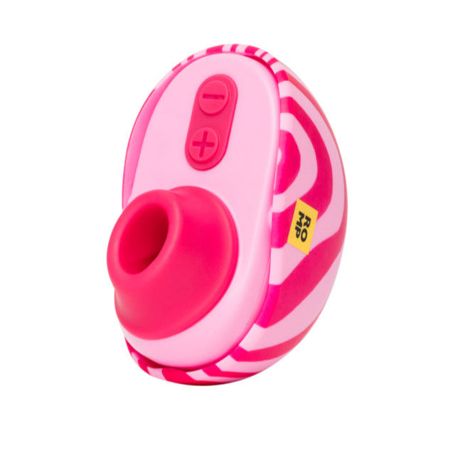 The Romp Spin Small Discreet Pleasure Air Clitoral Stimulator is a compact, oval travel vibrator with pink and white swirls, a circular silicone opening, two top control buttons (+/-), and a yellow "R20" sticker on the side.
