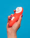 Switch Beginner's Pleasure Air Clitoral Stimulator in model's hand on blue background 