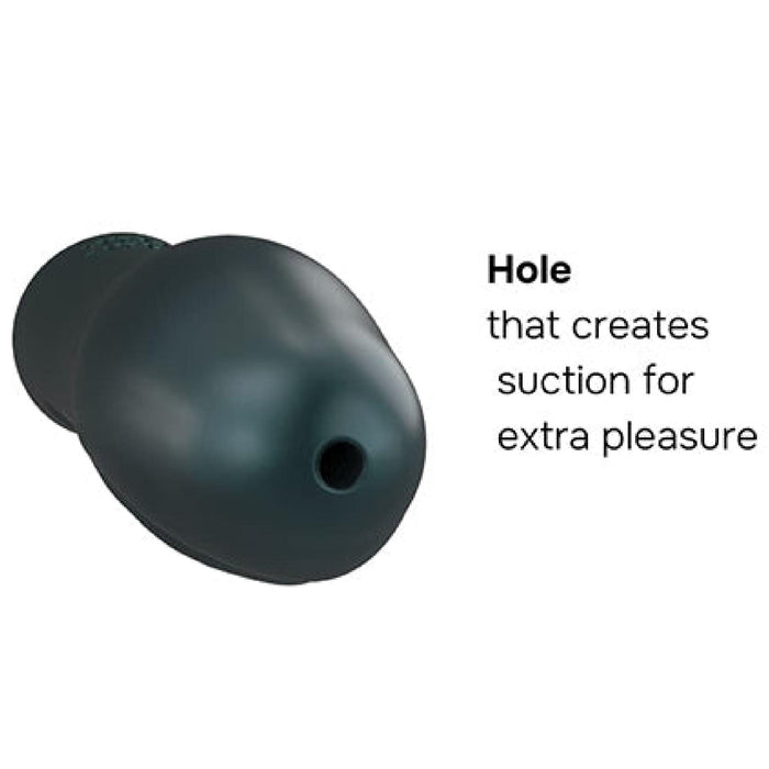 The Ryzer 2 in 1 Penis Extender and Masturbation Sleeve in Green features a textured, black silicone with a small hole for suction, providing extra pleasure. Made from liquid silicone, this stretchy ball strap ensures unparalleled comfort and durability.
