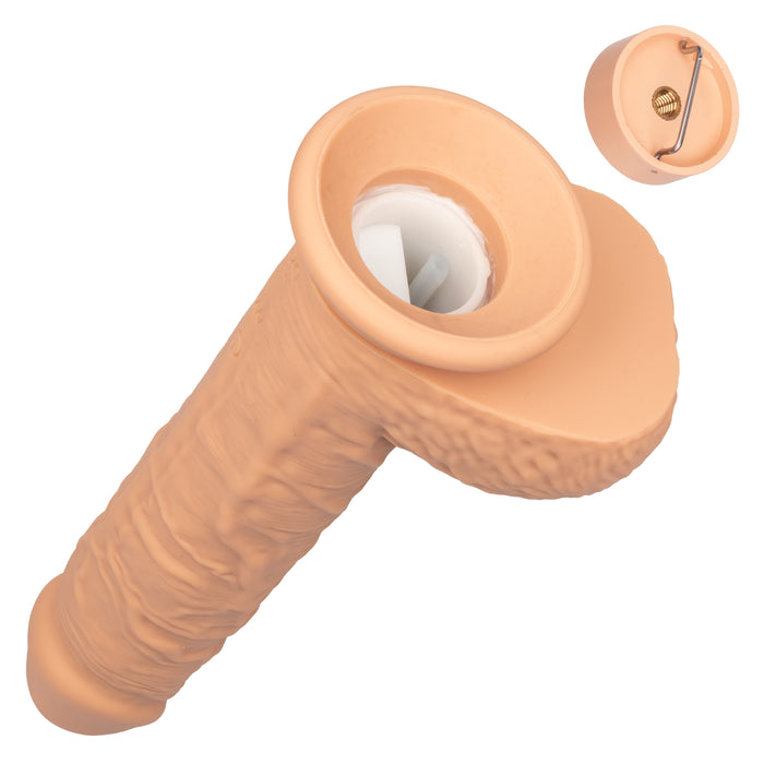 The Fuck Stick Squirting Vibrating Silicone Suction Cup Dildo - Vanilla from CalExotics is a flesh-toned, phallic-shaped object with a textured surface and a detachable cap at the base. This silicone squirting vibrator features an internal spring mechanism in the cap and appears designed for intimate use, offering unique sensations perfect for personal enjoyment.