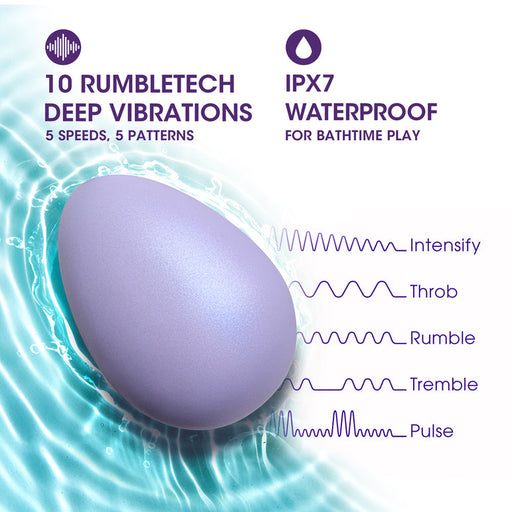 The Serene Silicone Waterproof Palm Vibrator, an oval purple massager, floats on blue water. Featuring 10 RumbleTech modes, 5 speeds and patterns, platinum-cured silicone construction, and IPX7 waterproof for soothing relief.
