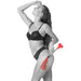 A woman in black lingerie smiles while posing, holding the Sex & Mischief Amor Red Heart Crop and Flogger with tassels against her thigh on a white background.