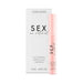 A pink tube of Sex au Naturel Clitoral Arousal Serum sits by its white and pink box, labeled with dual sensation effect. The packaging states the volume as 13 ml (0.44 fl oz).