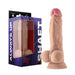 The Shaft Lifelike 7.5 Inch Light Tone Flexskin Silicone Dildo with Balls, made from Flexiskin liquid silicone for a realistic feel, is shown beside its blue and purple "SHAFT ALWAYS UP" branded packaging with a suction cup base.