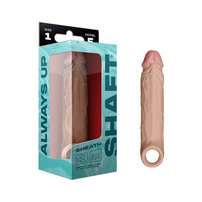 The Shaft Model F Ultra-Realistic 8 Inch Silicone Penis Sleeve with Ball Strap - Vanilla, made from FLEXISKIN liquid silicone, is shown next to its teal and black "SHAFT" and "ALWAYS UP" retail packaging.